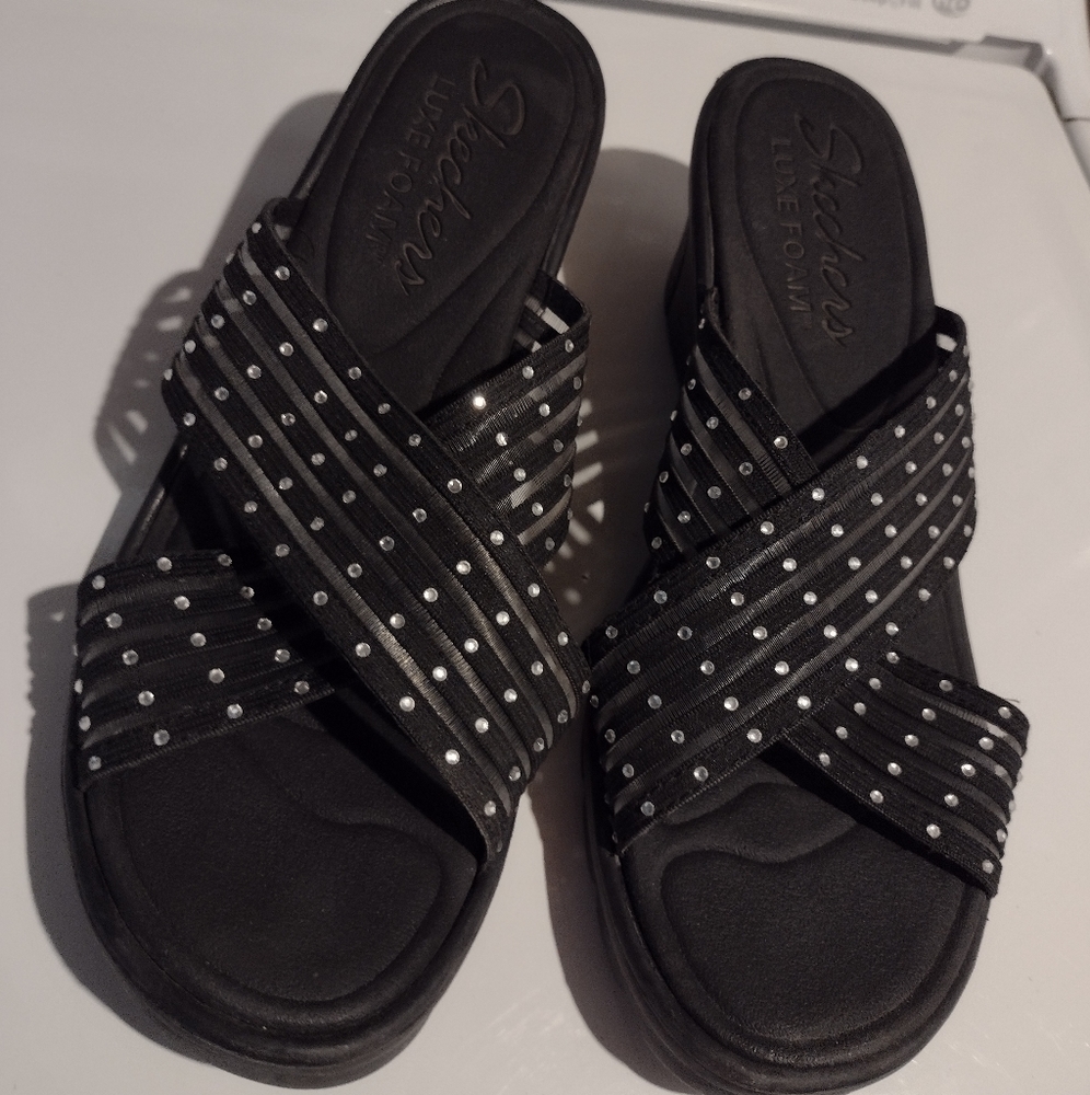 Black slip on Skechers luxe foam Size 10